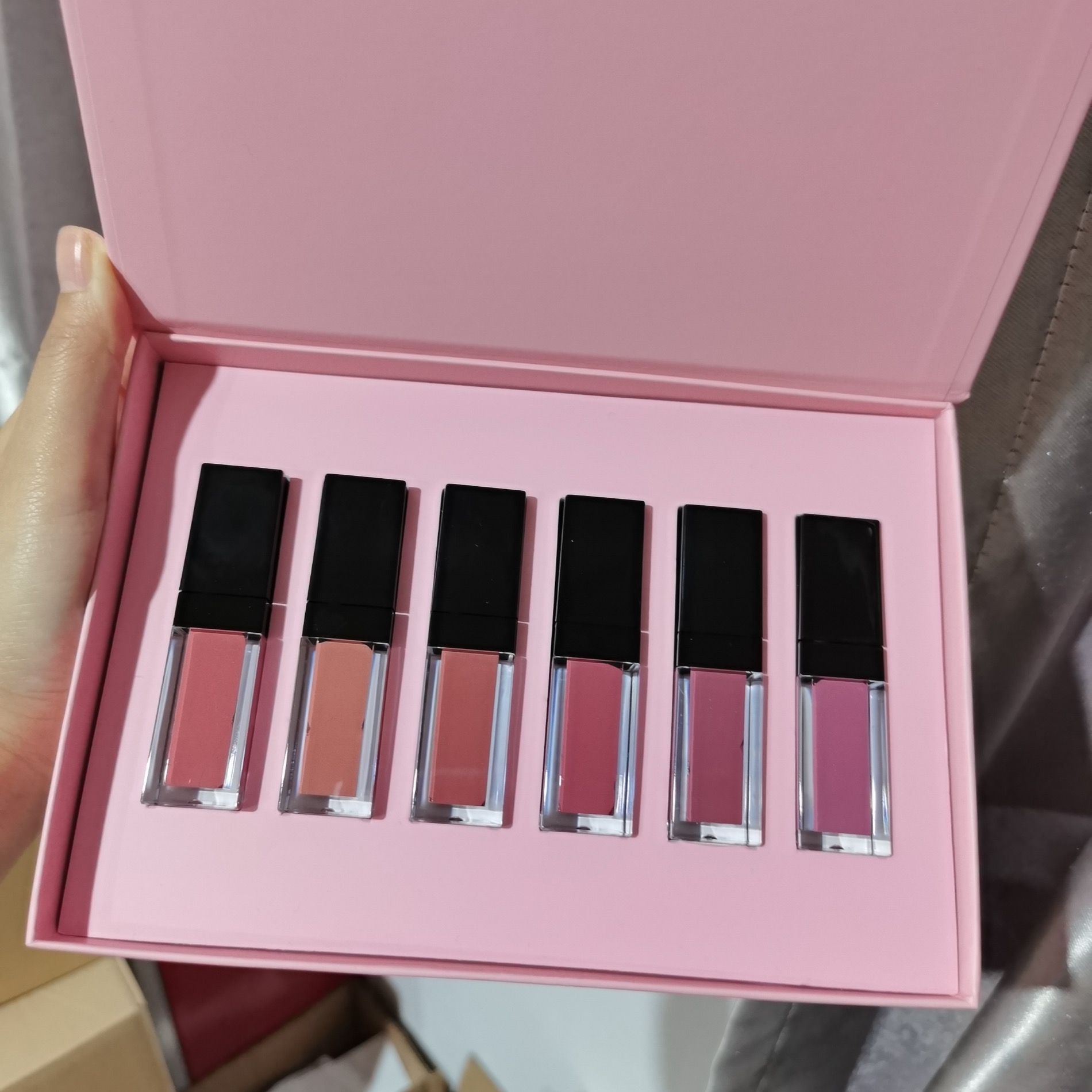 A lip color set in a custom pink presentation box